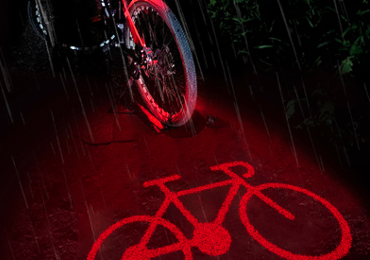 Faro posteriore per bici con proiezione logo